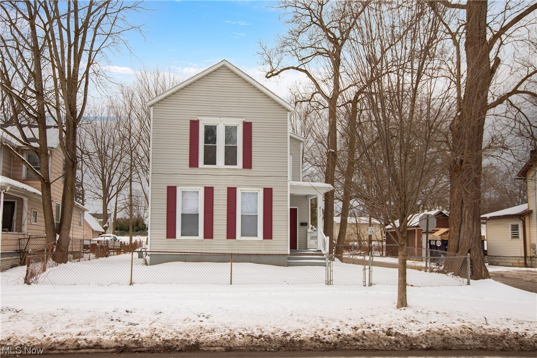 Discover a large home that is picture perfect & delightfully affordable for the owner occupant! Likewise, investors take note at this turn-key property with solid maintenance & BRAND NEW décor will have tenants fighting for occupancy. Situated on a prominent corner with rear parking, 817 East Ave is a quick commute to the expressways & a short stroll to Elyria’s historic town center! Professionally painted in soothing hues & clad in new carpeting from top to bottom, 817 East Ave features Soaring 9’ ceilings, extra large replacement windows & new 6-panel doors! A large rear entry mudroom w/oversized picture window is light, bright & practical – a perfect space to remove shoes, hang coats & enter the heart of the home – the remodeled Kitchen! BRAND NEW cabinetry is abundant; new Lifeproof LVP flooring, new lighting, a new GE Dishwasher & built in Microwave are some of Kitchen’s gems PLUS a bonus 12'x5' eating area! Adjoining the Kitchen is an oversized Family Room or Formal Dining Room well serviced by a delightful updated Half Bath. 2 generously sized BRs complete Level 1! Up are an additional 2 oversized BRs with impressive closets + a bonus room which overlooks the rear yard & is perfect for a playroom, studio or A+ storage! Perfectly situated is a beautifully updated Full Bath, smartly equipped with Lifetime Moen hardware, an attractive solid surface vanity with cavernous storage, and an easy maintenance new shower surround with oversized niche and pristine new tub. The super clean & dry unfinished basement features full waterproofing, an updated electrical panel, sump pump + a wall mounted single bowl utility sink; washer/dryer hook ups are in place. Here are well-maintained mechanicals, including a Rheem Hot Water Tank (2017). The workmanship in this special home is matchless & will not disappoint! Come see today!