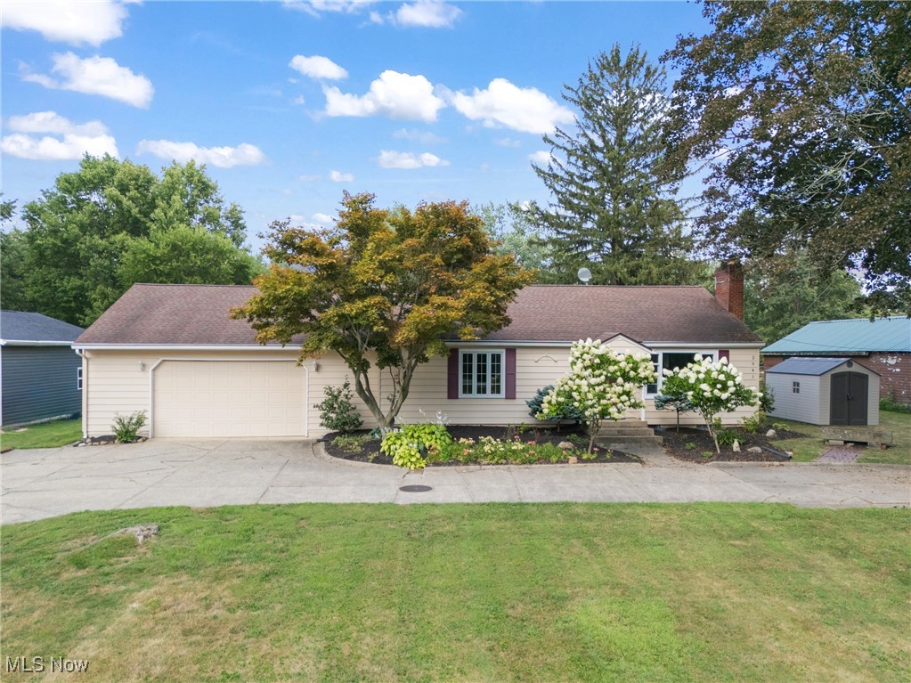 Bright, updated, and full of character, this spacious Copley ranch blends style, comfort, and function inside and out. Thoughtful updates, abundant storage, and multiple bonus spaces make it a home you can truly grow into.
The main living area is filled with natural light and connects to a versatile bonus space, perfect for dining, an office, or a relaxing sitting area. The kitchen features granite countertops, stainless steel appliances, a center island with storage, custom cabinets that offer pull-out drawers and tucked-away storage to maximize space, and a walk-in pantry. The dining area overlooks the backyard through beautiful windows, and a character-filled sunroom features exposed brick and new Italian tile.
Three bedrooms are tucked away from the main living spaces, including an owner's suite with a private half bath. The full bath features a skylight that fills the space with natural light. Additionally, laundry is conveniently located on the main level.
The partially finished basement adds even more usable space for a media room, playroom, or home gym. Modern touches like LVP flooring, fresh paint, and LED lighting give the home a fresh, move-in-ready feel.
Storage is a major highlight, with large closets, a coat closet, and two outdoor sheds, one equipped with electric and gas utilities. The attached 2.5-car garage has high ceilings, perfect for a workshop or additional storage.
Recent tree removal has opened up the yard, creating a more spacious feel and added peace of mind.
With a great location in the heart of Copley, this home offers the space, updates, and versatility to fit your lifestyle now and for years to come.