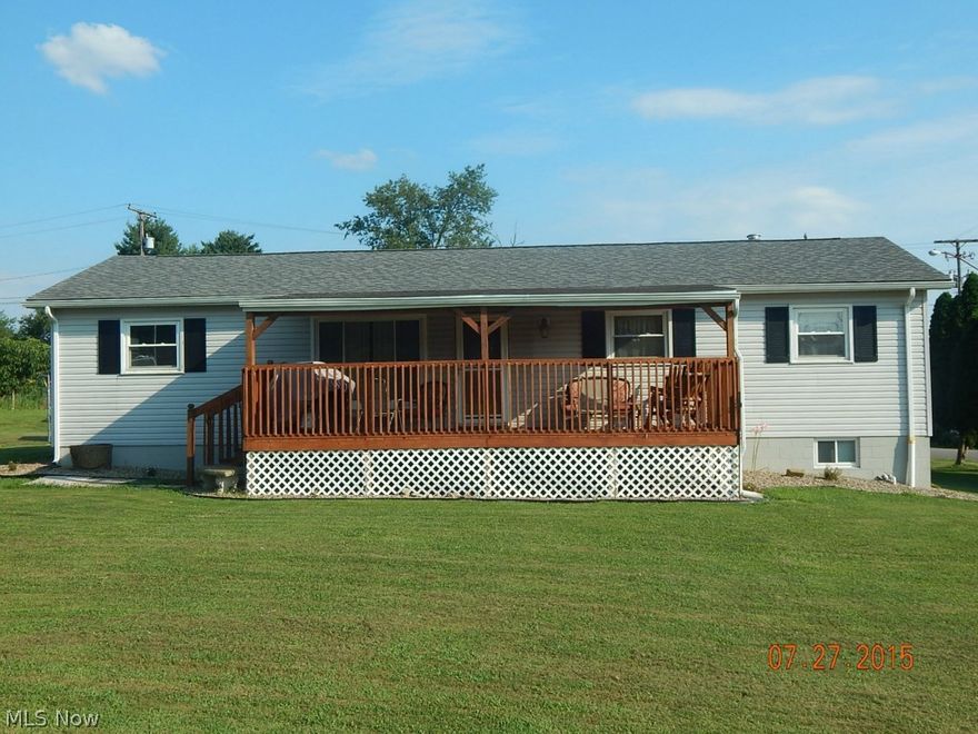 This home, located near Jackson Park has great view of the water from the new extra large covered front deck.  Spacious corner lot, plenty of yard space and a covered back patio to enjoy shade during summer.  New wood flooring in kitchen and dining area, newer carpet and paint. The 1st floor has 3 BR, living room and full bath as well as eat-in kitchen.  The full basement has laundry hookup, plumbed for 1/2 bath with possibility of full bath.  Attached 1-car garage has electric and heat.  So much updating to this home all within the past 5 years.