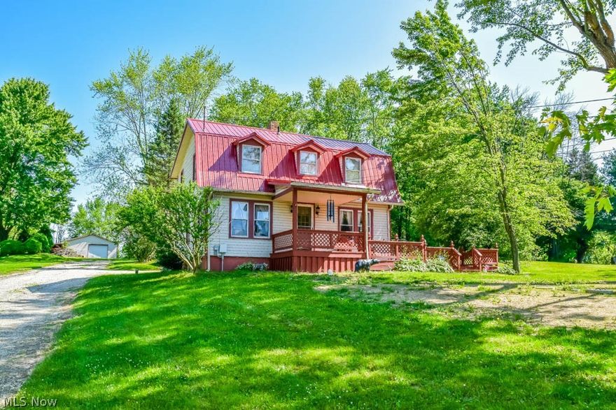 Wonderfully cared for 3 bedroom home on 3 acres in Marlington school district! Wooded acreage with plenty of cleared areas to enjoy. Tons of parking with a long driveway to the well-insulated 62x32 heated outbuilding with electric. There is a 15.5 garage door on the front and back. To the side, there’s a 50-foot deep covered carport for trailers or RVs. Amazing for car enthusiasts or hobbyists! Whip up your favorite recipes in the recently remodeled (2017) kitchen! Fully applianced and offering tall cabinets, soft-close hardware, lazy Susans, tile backsplash and tons of counterspace! The formal living room is huge and has crown molding, many windows and neutral colors. The formal dining room includes a boxed window and coat closet. Upstairs, there are 3 bedrooms, a full bath AND second floor laundry! Tons of storage in the full basement. Oversized 2-car garage with an opener. Behind the garage, there's an adorable shed perfect for a playhouse! Enjoy these summer days from the partially