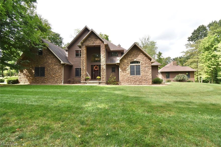 Come fall in love! Breathtaking views from the moment you enter the grounds of this 12.6-acre private paradise with amenities galore! A picturesque winding driveway crosses by the creek as you approach the quality built 4/5 bedroom & 3.5+bath architectural beauty! Fully appointed custom kitchen, leather-buffed granite counters, induction cooktop, copper farmhouse sink, breakfast bar, morning nook, formal dining room, 1st floor laundry room & more! Great Room w/2 story stone fireplace, white oak hardwood floors & stunning wall of windows overlooking grounds! Master bedroom w/vaulted ceiling & doors to patio. Double sided fireplace in MBR & MBath. Master bath features a garden tub, walk-in shower & even a bidet! Dual walk-in master closets. Additional 1st floor BR/office & powder room. 2 story foyer. 2 BR up w/Jack & Jill bathroom & walk in closets. Lower-level has large recreation room, Pub style wet- bar, bath, 5th bedroom or home office & lots of storage. Geothermal heat. *Separate basement entry & more!! Circular drive to 3+ car attached garage. Outdoor living space w/stamped concrete patio, outdoor grilling station, inground pool, fireplace, pool house/cabana,1/2 bath, changing room & kitchenette. The 2-story renovated barn has endless possibilities! *This property offers plenty more for the outdoor enthusiast! Located in Salem Twp. Minutes from Greenway Bike Trail, Columbiana & Salem. Approx. 1 hour drive to Pittsburgh & Cleveland. Call to schedule appointment to view!
