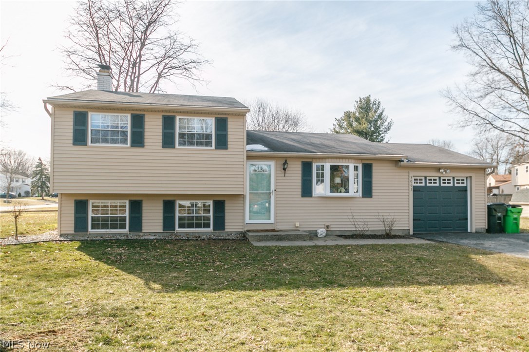 Move right into this split level in a quiet neighborhood in Stow! Open concept kitchen, dinette and living room with well-cared for hardwood floors, perfect for gathering and entertaining. Kitchen remodeled with Kraftmaid cabinets, updated counter tops and back splash, and stainless steel appliances. Cozy family room with beautiful white-washed stone fireplace. Three bedrooms with newer laminate floors. Plenty of storage with an additional crawlspace under the main level. Enjoy relaxing on your deck or eat lunch on the patio overlooking the large treed corner lot. Most everything has been updated throughout the home including newer windows, HVAC, siding and remodeled bathrooms. Schedule your private showing today, this one won't last.