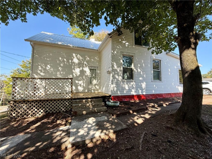 Own a piece of history with this beautifully maintained 1890 residence, offering the perfect blend of historic character and modern updates. This spacious home features 4 bedrooms, with 2 conveniently located on the main level. The primary suite includes a private full bath with a walk-in shower, while the second level offers 2 additional bedrooms and a full bath. Recent updates enhance both style and function, including new linoleum flooring throughout, fresh interior paint, numerous new windows, and two newly constructed decks ideal for outdoor living. The home also retains its original summer kitchen, a rare and unique feature that reflects its historic charm. Located in a convenient in-town setting, this property provides easy access to local amenities while offering timeless appeal and modern comfort.