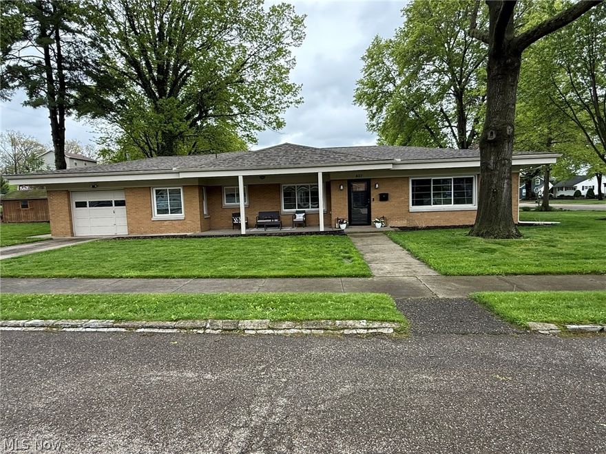 Beautifully remodeled brick ranch.  Charming covered front porch invites you into this fantastic home.  Open floor plan with neutral decor, new drywall and wood laminate flooring.  Brick fireplace in the living room.  New white kitchen with Quartz counters and stainless steel appliances.  Remodeled full bath features quartz counters and double sinks.  Main floor laundry room.  New gas furnace with central air and new Provia windows in 2024+/-.  New asphalt roof in 2023+/-.  Attached garage with hot and cold water access and 16 X12 storage shed.  Large corner lot with 16 X 12 private rear patio.  A must see, move in ready home on the corner of Oak Street and Bowers Avenue.