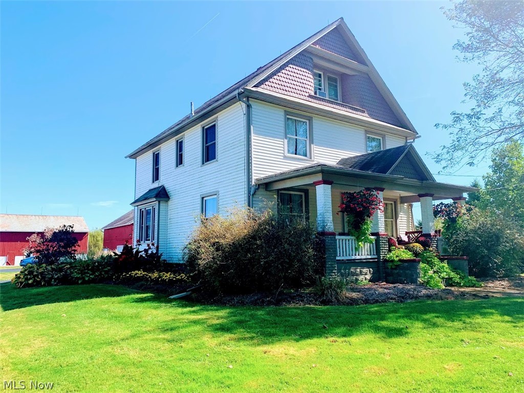 CHARMING COLONIAL with almost 2,700 S.F. on 4.5 ACRES is in EXCELLENT CONDITION top to bottom! Featuring Living Room/Family Room with BEAUTIFUL original OAK WOODWORK; Formal Dining Room with built in window seat; Kitchen with custom built cabinetry, corner sun nook, breakfast bar and all appliances; Half Bathroom on first floor; OAK STAIRCASE leads to THREE BEDROOMS with large closets; Full Bathroom with whirlpool bathtub & custom vanity area; SECOND FLOOR LAUNDRY (could potentially be fifth bedroom); Master Bedroom with walk in closet & two additional closets (located on third floor); Master Bathroom with corner seated shower; Full Basement with REC ROOM, Bonus Room & walk out to AMAZING PATIO, DECK and FRONT PORCH for relaxing. The 40x60 Shop has 3 phase electric, corner office, two overhead garage doors with loading area. Two additional Outbuildings feature 40x24 Garage with upstairs storage; 56x34 Bank Barn Building set up as heated shop with upstairs storage, half bath, 42x20 stee
