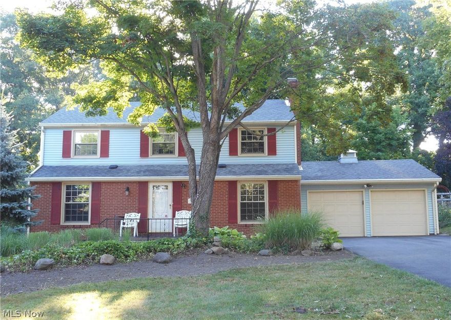 Spacious 4 bedroom colonial with hardwood floors throughout most of the home.  Inviting family room accented with fireplace, could be used as a first floor bedroom.  Some rooms have been freshly painted.  French doors off the dining room give you access to the backyard with storage shed and greenhouse.  The applianced kitchen offers some newer cabinets with glass front doors, a breakfast bar and newer counter tops.  A convenient 1st floor laundry with storage is a plus.  The second floor master bedroom features a walk-in closet and a full bath.  The partially finished basement offers both a rec room and a workshop area.  A whole house dehumidifier and 2 car garage complete this home.