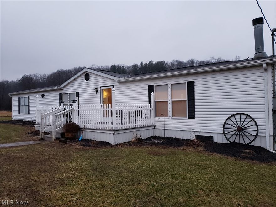 Very well cared for 3 bedroom, 2 full bath home that is spacious and open on 5 acres! Plenty of room to roam as this property has 1 acre of fenced area a 24x48 outbuilding/garage and 8x14 shed with electric. There is a small stream that runs through the property.New carpet in the bedrooms, large open kitchen with and island with seating and a large master suite. There is an maintenance agreement among the neighbors for the private road maintenance, $50 a quater to pay for the common road area and each property owner is responsible for in front of their own property. There is an additional area on the property for a 2nd home (well).