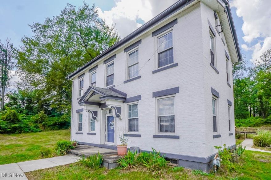 Built in 1835, the Peter Pontius House is believed to be one of the oldest homes in the county! This Federal style farmhouse offers 2604 square feet and has been updated with modern touches while preserving original details like hardwood floors, wide moldings, and exposed brick accent walls. A stone fireplace anchors the living room, and a front den or parlor adds extra space for relaxing or working from home. A massive dining area connects to the hearth room with a wood burning fireplace, brick surround, and built in bookcase. Nearby, the kitchen features a tile countertop, tin ceiling, and good cabinet storage, with the refrigerator tucked into a butler’s pantry that also works as a mudroom with side entry. In the family room, a vaulted beamed ceiling, built in desk, wall of closets, and French doors to a huge back deck make it a great spot for gatherings. A half bath completes the main level. Upstairs, you’ll find two comfortable bedrooms and a full bath with a step in shower. Updates include a newer roof, electric panel, hot water tank, water supply lines, deck, and sidewalks. The home is being sold with one acre, with the option to purchase additional land. A wonderful opportunity to create your own vision while enjoying the history and character of this special home. Call today!