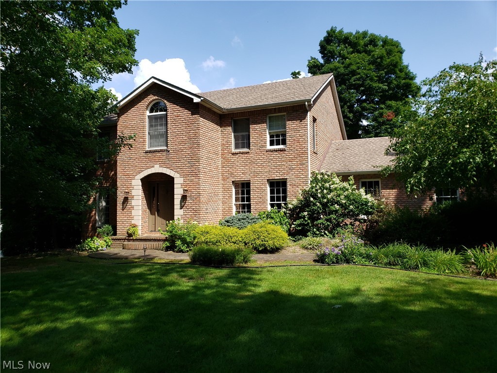 This one owner, all brick home, lovingly cared for, is a classic center hall colonial located in a park like setting on a 1+ acre lot. As you enter from the flag stone porch and walk, you will quickly recognize you are in a custom designed home. The spacious foyer, flanked by an office and formal living room welcomes any visitor. The functional, open floor plan, blends the kitchen, family room, and formal dining room that is perfect for family gatherings and entertaining. The family room features a custom designed stone fireplace and oak entertainment center. The french doors bring in nice light and access to the three tiered deck that overlooks a neighboring pond and beautifully manicured backyard enjoyed in all seasons. The first floor laundry is conveniently located steps away from the gourmet kitchen with prep island. All bedrooms are ample sized with large closets and loads of storage space. The master bedroom and bath are nicely updated with newer carpet and flooring. The master