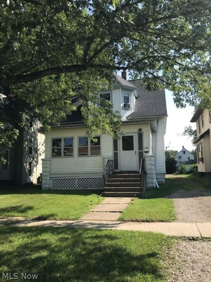 Spacious Colonial  This home has 3 bedrooms and 2 full baths. There is a bedroom and a full bath with a walk in shower on the main level. The front porch is enclosed for extra storage or more living space. There are hard wood floors in the living area. The kitchen is very spacious with an eating area. Perfect for family gatherings. Most windows have been updated. The basement was waterproofed and has glass block windows. Newer furnace and hot water tank.