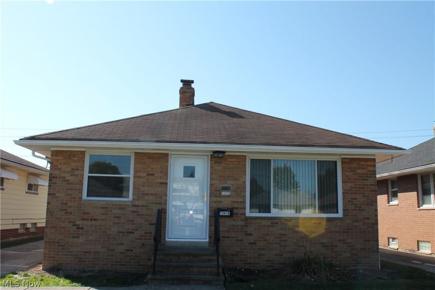 Welcome Home! This brick Garfield Heights ranch is located on a quiet street in a great neighborhood with obvious pride of ownership. The concrete block garage is built to last and features a new garage door with opener. The brick exterior is complemented by newer vinyl windows, new exterior doors, new screen doors, and vented glass block windows for natural basement light. The inside of this home features a wonderful floor plan. The finished basement rec room with recessed lighting is perfect for family activities and entertaining, the half bath in the basement provides obvious convenience. The property has three bedrooms with ceiling fans, central air, a large living room with built-in shelving, and a formal dining area. This home is fresh and is highlighted with fresh paint, newly refinished natural hardwood floors, new laminate kitchen flooring, new appliances, updated electrical panel, new light fixtures, and new carpet. This fine home is move-in condition and violation free.