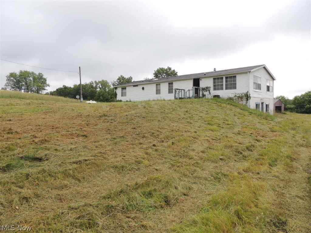 Doublewide located on almost 16 acres of beautiful land. Approx. 615' of frontage.