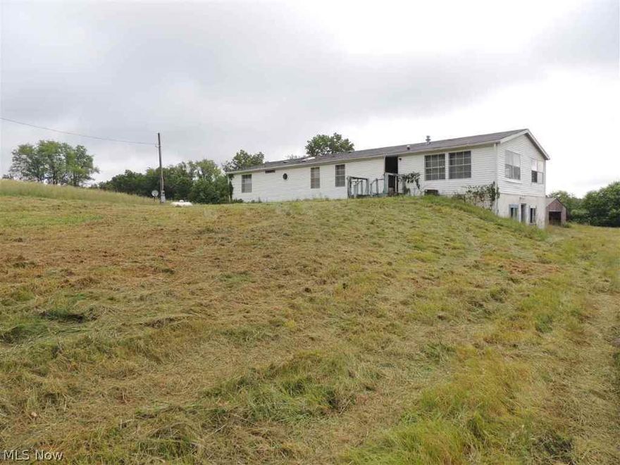 Doublewide located on almost 16 acres of beautiful  land. Approx. 615' of frontage.