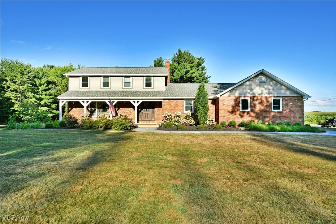 Pack your bags, your personal backyard paradise awaits at this remarkable Canfield estate! Nestled on nearly eight acres of private seclusion in a highly desirable location, this property delivers the perfect blend of serenity and convenience, just moments from top-rated restaurants, shopping, and entertainment. Boasting two full floors of finished living space plus a walk-out basement complete with a game room, there’s truly something for everyone. A long blacktop driveway transitions to cement as it approaches a spacious outbuilding, ideal for equipment or vehicle storage. Out back, escape to an expertly designed, fully fenced oasis featuring a stone terrace with coordinating walkways. Enjoy peaceful evenings beneath the large pavilion, listen to the burbling fountain, or gather around the natural gas firepit, every detail thoughtfully crafted with breathtaking views in mind. Step inside to find a grand foyer flanked by a private home office and a gracious living room, both accented with hardwood-style flooring. The main hall leads past the open staircase to an impressive kitchen, where a massive island, professional-grade gas range, stainless steel appliances, and stone countertops create a true chef’s dream. Casual dining enjoys scenic poolside views, while the adjacent window-lined sunroom transitions beautifully into a formal dining space. Step down into the cozy family room, where a towering brick fireplace takes center stage. Nearby, you'll find a convenient full bath and first-floor laundry, adding everyday practicality to the home’s thoughtful layout. Upstairs, four generously sized bedrooms line the hall along with a beautifully updated full bath. The oversized master suite is a true retreat, showcasing a large walk-in closet and dressing area, plus a show-stopping spa bath featuring a glass-lined water jet shower, soaking tub beneath a starlight ceiling fixture, and a cozy fireplace that sets the mood.