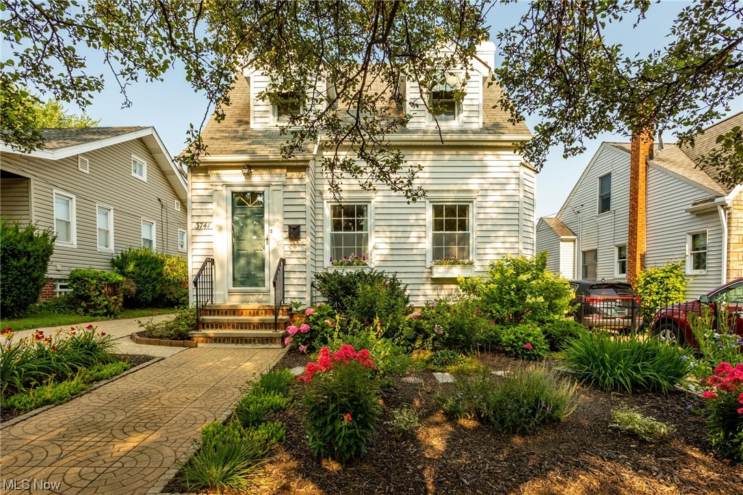Charming Cape Cod in Cleveland. A beautiful and welcoming walkway with gorgeous landscaping leads you to the front door of this charming home. Entry way with closet leads to the living area with beautiful hardwood floors which continue into the nice sized dining room with a built in corner shelving unit. Plenty of windows to let the sunlight shine in. The kitchen has luxury vinyl flooring, great counterspace with plenty of cabinetry and great bench seating. Bring a table and you have a cute breakfast nook overlooking the gorgeous backyard. Two nice sized bedrooms upstairs. A full bath that hides a surprise behind it, an extra door with an office including shelving. Downstairs has a well finished room with luxury vinyl flooring that provides additional living space. The back door leads out to an adorable covered deck overlooking the beautifully landscaped back yard. The home is not one you want to miss seeing.