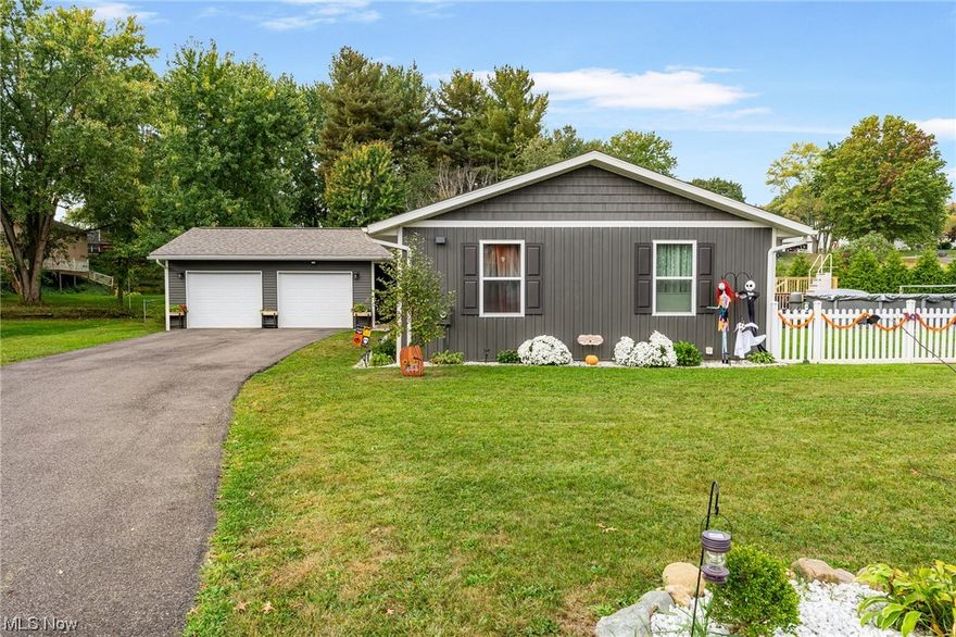 Welcome home to this beautifully updated, open and bright 3 bed/2 bath ranch in Canal Fulton!  The kitchen has white cabinets with black hardware, brand new stainless steel appliances (2021), large island with granite countertops and plenty of cabinet and counter space.  The dining room has a beadboard accent wall, new ceiling fan and loads of natural lighting.  The great room has plenty of space to relax and enjoy a cozy fire (new gas fireplace insert 2022) and white brick wall surround.  There is an additional space (currently used as office) with built in desk and entire wall storage, white brick accent wall and additional closet.  As you walk back towards the bedrooms, a closet on the left has washer/dryer capability for easy one floor living!  Primary bedroom comes with an attached full bathroom with ceramic floor, oversized vanity, built-in linen closet, and tile surround shower with glass door.  Two additional bedrooms and additional full bath with ceramic tile floor and deep tub/shower combo finish off the first floor.  The basement has an 8x17 workshop and large 12x19 finished room with laminate flooring.   Additional massive and open 24x41 rec room in basement ready for finishing touches! Outside the sliding glass patio door is a large 24x25 deck, 24ft above ground pool, oversized 10x20 shed, bonfire area all surrounded by vinyl picket and privacy fencing - a perfect oasis for entertaining!