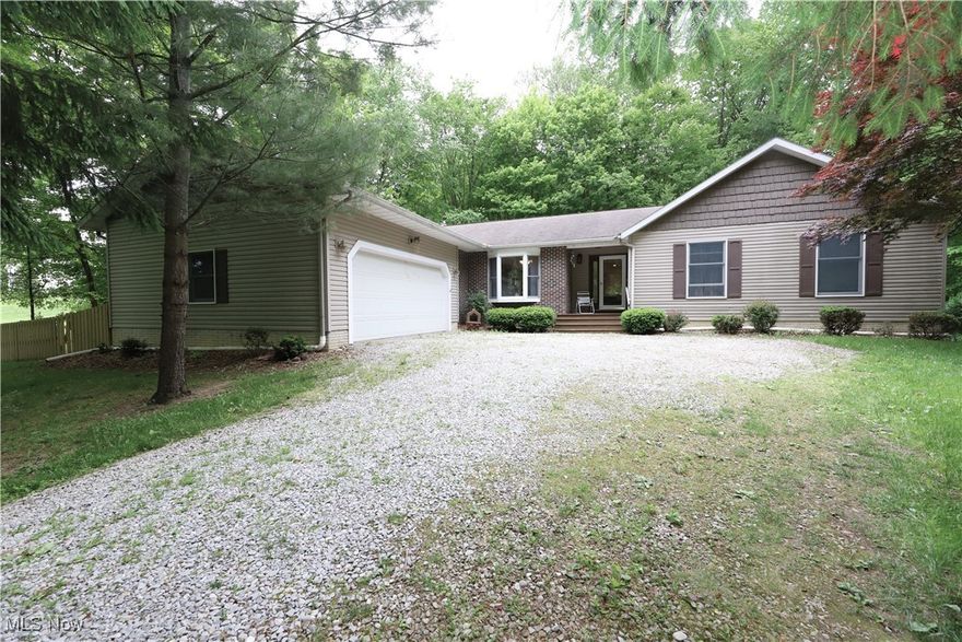 Beautiful Ranch nestled on 5.2 wooded acres in Spencer.  Updated eat-in Kitchen with granite, double ovens, cooktop range, loads of cabinetry & a wood beam that opens to the Family Room with wood floors, wood burning insert stone fireplace and a slider that walks out to the large deck. Formal Dining Room.  Living Room offers a window wall. Owner's Suite with slider to large 2nd deck and steps that lead to a paver patio with firepit.  Barn door slider leads to the updated primary bath with double sinks & a large walk -in closet. Large spare bedrooms.  Updated full bath with-walk in tile shower.  First floor laundry and 3rd bath are found at the other end of the home.  Full unfinished basement perfect for finishing or storage.  Geothermal Heat.  Some updated include HWT 2015, furnace condenser 2017. Fenced in area perfect for pets.  There is a 25x35 outbuilding perfect for storage & workshop area. Pride of ownership is evident here! A must see!