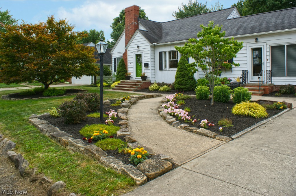 This beautiful West Akron home is a must see. Step inside the large, bright and open kitchen with vaulted ceilings in the attached eating area. The formal dining rooms is past the kitchen and looks into the living room complete with wood burning fireplace. Hardwood floors throughout. Two large bedrooms occupy the first floor with the master bedroom on the entire second floor. A carpeted finished basement PLUS an additional wood burning fireplace! Nicely lit and has glass block windows. The front and back yards are nicely manicured and landscaped. A large open flat backyard proved lots of space for entertaining and having a great time! Call today to set up a private viewing.