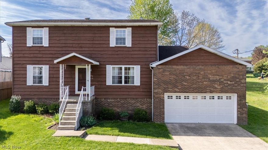 Listings like this don’t come along often—and this one has been worth the wait!

Welcome to 87 Cummins St, tucked into Bethel Addition in Washington, WV, just minutes from US Route 50. Built between 1976 and 1977 and lovingly cared for by its one and only owner, this classic colonial has been thoughtfully maintained, upgraded with energy-efficient features, and filled with decades of memories.

Step through the front door into a warm living room that flows into a spacious kitchen and eat-in dining area—the heart of the home. The kitchen renovation brought granite countertops and Haas custom cabinetry, creating a space that’s both functional and inviting. The eat-in area features a breakfast bar and room for a large table—perfect for gatherings.

Sliding Pella doors lead to two back decks overlooking a lush yard—ideal for morning coffee or evening relaxation.

Just off the kitchen, you’ll find a cozy den complete with a wood-burning fireplace and an upper-level nook perfect for a home office or reading retreat.

On the opposite side of the kitchen, a formal dining room with chandelier provides space for special occasions. Nearby, the main-floor laundry room includes a Speed Queen washer, electric dryer, and large wash basin.

Upstairs are four generously sized bedrooms, each with oversized closets. The primary bedroom includes a spacious 6' x 6' closet and private full bath. A second full bathroom upstairs was remodeled within the last decade with updated cabinetry and a luxurious heated floor.

Downstairs, the basement features a geothermal heat pump system (2019). Combined with solar panels installed in 2016, this energy-smart home keeps electric bills remarkably low—often near $0. The basement also offers a spacious workshop with built-in shelving.

A one-owner home, thoughtfully upgraded, energy efficient, and ready for its next chapter—87 Cummins St is ready to welcome you home. Ask your real estate agent to show you your next home today!