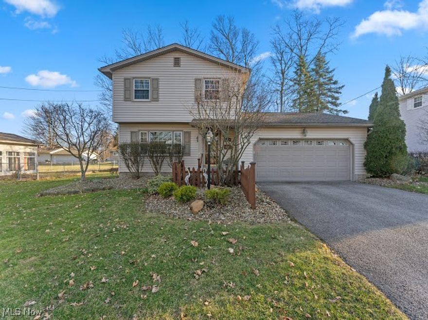 Welcome to the heart of Austintown! As you enter this charming 2 story home you will be greeted by a ceramic tile entry way. Just to your left you will find the living room bright with natural light. The custom kitchen offers a great gathering space with sleek granite countertops, a generous eat in area as well as a peninsula counter with additional seating adjacent to a beautiful built-in cabinet. A half bath for convenience is located near the cozy family room complete with wool carpet and a brick fireplace. The sliding door leads you to a large deck and hot tub. The second floor consists of a large master and 2 additional bedrooms. The full bathroom boasts a marble shower. The partially finished basement was previously used as an office space while the remainder was used for storage, laundry and includes a full shower. Furnace replaced March 2025, hot water tank 2022, glass block 2024. This house is ready to become your home! Schedule your showing today!