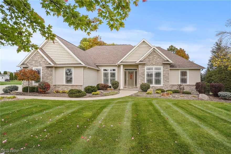 Welcome home to this fabulous custom ranch home nestled on 2.5 wooded acres on quiet cul-de-sac in Sharon Twp.  This property showcases an open floor plan with sweeping 10' ceilings, beautiful 3/4" ash hardwood floors, and numerous transom windows.  Welcoming covered entry to gracious foyer with leaded glass door.  Pocket door leads to office with bookshelves and recessed lights.  Formal, pillared dining room.  Engaging great room presents a gas stone fireplace, wall of built-ins, and windows that offer views of wooded backdrop.  Gourmet kitchen features white cabinetry, granite counters, tile backsplash, SS appliances, pantry closet, breakfast bar, and separate eating area with sliders to covered patio.  French doors to owner's suite with tray ceiling and glamour bath with double vanities, water closet, and walk-in closet.  Two additional bedrooms, on opposite side of home, share Jack-n-Jill bath.  Laundry room with utility sink and guest bath are conveniently located.  The lower level (ready to be finished by the discernable buyer) highlights 13 course, rough in for full bath, 2 sumps (replaced in '21), R/O system, generator, radon mitigation added as a preventative measure in '22.  Additional amenities include sound system w/speakers, partially covered colored stamped concrete patio, gas fire pit, outdoor kitchen w/refrigerator and grill w/side burner, new landscaping. 3 car garage.  Highland Schools.  Home Warranty offered.