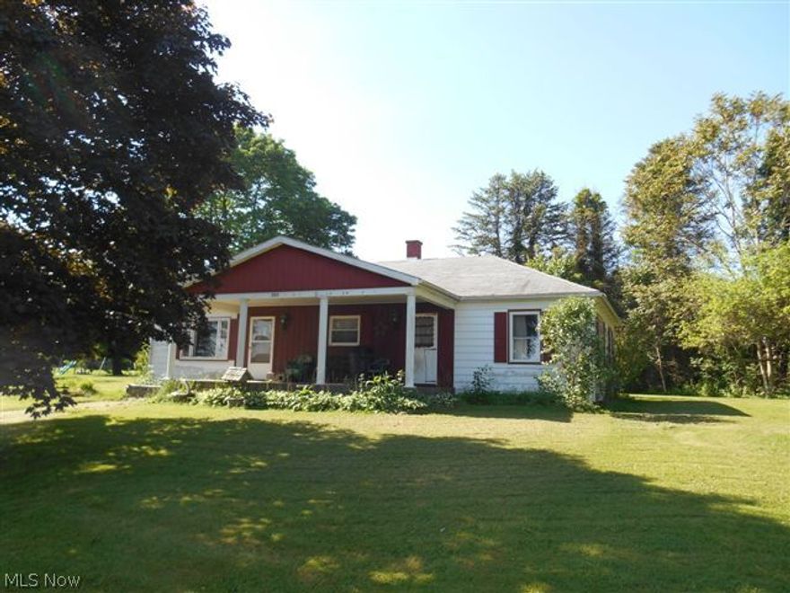 Great price for a 3 bedroom ranch with a huge 28x40 building sitting on a 1 acre lot.  Big living room with a stone fireplace, a large eat in kitchen with hardwood floors, 3 bedrooms and full bathroom.  Other features include a full bsmt., newer 90% efficient gas forced air furnace, wood burner in the bsmt. helps save on heating bills, walk up attic, public water, convenient location and more.  Needs a little TLC but it's surrounded  by much higher priced homes.
