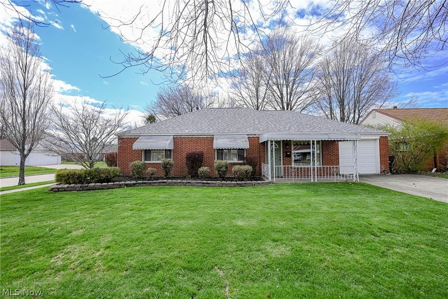 Welcome home to this charming, all brick ranch on a corner lot in Euclid! With nearly 2,000 square feet of living space, this home is one of the larger homes on the street. It is just waiting for your finishing touches. A covered front porch leads to the open plan living and dining area. The eat-in kitchen features plenty of cabinetry and all appliances, including a countertop range and double ovens. At the back of the house, there is a spacious family room with a wet bar and a gas fireplace. Down the hall, you will find three spacious bedrooms and two full bathrooms. The interior of the home is completed by a laundry room with appliances included, a double sink for soaking, and storage cupboards. Outside, there is a nice back patio with a privacy fence, plus there are lovely front garden beds with stone hardscaping, and the driveway fits four cars. Recent improvements include a new roof in 2021 with new gutters and gutter guards! Situated on a large corner lot in Euclid, this home is