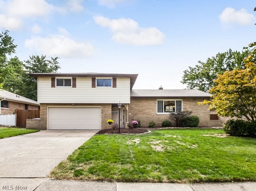 Move right into this well maintained & nicely updated 3 bedroom 2.5 bath split level home.  The main living area of this home features spacious living & dining rooms with coved ceiling & hardwood floors.  The kitchen has plenty of cabinets, a large island & updated stainless appliances.  The family room features an updated gas fireplace with remote 2016 & has a sliding door which opens onto the 10x26 covered patio overlooking privacy fenced yard 2016.  The lower level rec room was renovated in 2015 & laundry/utility area has new tile flooring.  Head upstairs to the large master suite with renovated master bath featuring new tile shower with glass door, new vanity, flooring & all new fixtures 2014.   Another full bath & two additional bedrooms featuring hardwood floors & closets with organizer systems complete the upper level.  Additional features & updates include:  vinyl windows, glass block, updated electric panel, complete tear off roof 2013, gutters 2013, H2O tank 2013, High effici