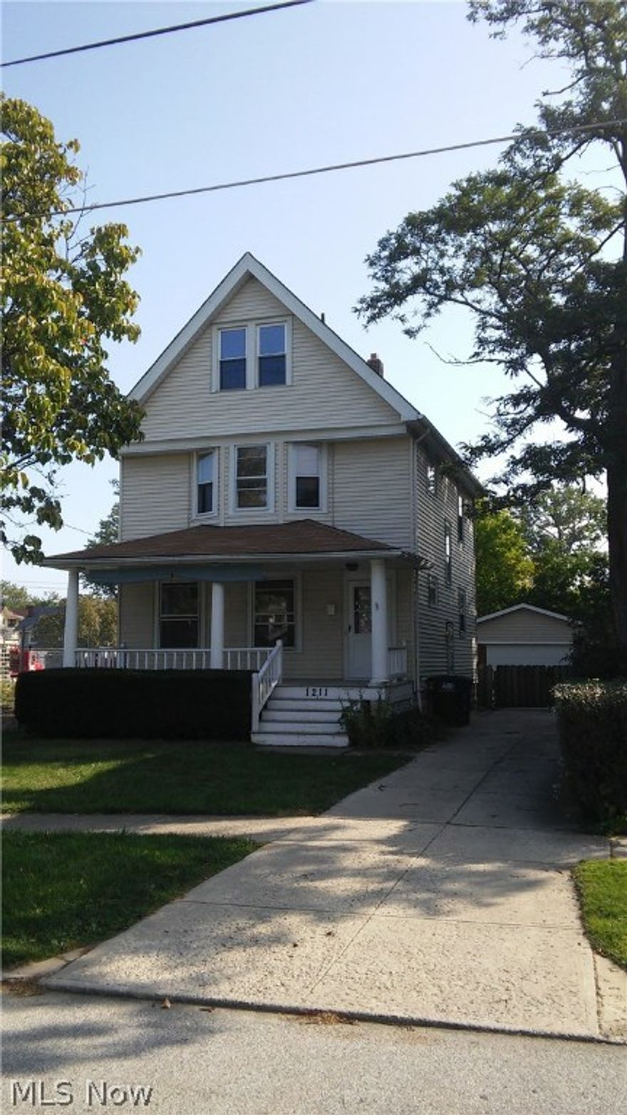 This is a lovely 3 bedroom, aluminum sided colonial on a fantastic street in Northwestern Lakewood near the lake, parks and public transport. The 3rd story has recently been finished off with a dedicated space to add a half bath. Newer built detached garage and driveway. Freshly painted. Large mature trees. Are you ready to call Lakewood home? Priced to sell!