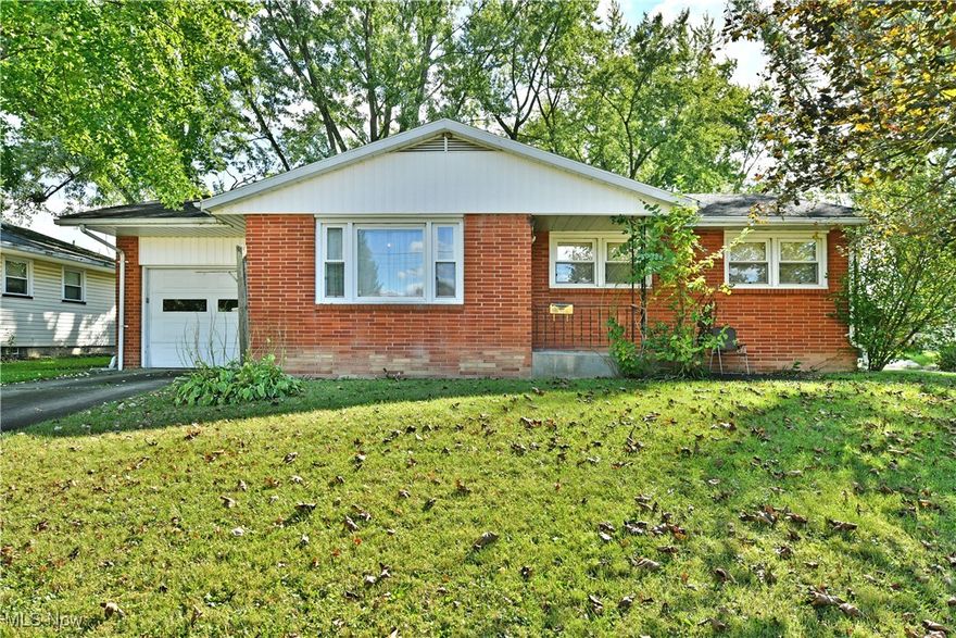 The potential is only limited by your creativity as you take advantage of this fantastic Warren residence! Quick to excite with its all-brick construction and a desirable, three-bedroom ranch layout, you won’t want to miss this great opportunity. Sitting proudly on its raised lot, a covered front entryway offsets the single car attached garage while the cement driveway rises from the street. The warm colors present a lasting, handsome look with low maintenance for years to come. Around the back, the fenced-in yard includes a large storage shed as tall trees create a park-like setting. Inside, the tiled foyer opens to a spacious living room where hardwood flooring enjoys the natural light provided by the sizeable picture window. The flooring continues down the main hallway as it spills into each of the robust bedrooms. The trio are joined by a colorful bath with a charming vanity and floor access shower with handrails for easy accessibility. Meanwhile, the substantial kitchen includes plenty of eat-in dining space as the wood cabinets are accented by the faux brick backsplash. Down below, a full basement offers plenty of rec and storage space alike along with laundry provisions and utility access. Call today for your private showing! 1 Year Home Warranty included.