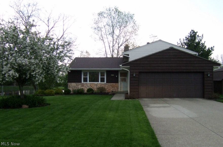 Need some peace & tranquility in your life? This updated 3 bedroom split overlooks breathtaking lake & professionally landscaped yard. Remodeled kitchen, L-shaped living & dining rm w/slider to deck. Plenty of room to entertain & expand your dining table. Main bath remodeled '05. Roof, gutters, siding, windows & doors 3 yrs. Driveway '07. HWT '12, new flooring & carpeting throughout 3 yrs. Take an evening dip in the hot tub on your patio off LL family rm.