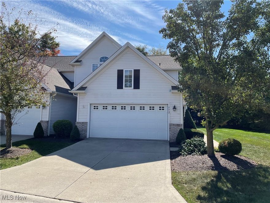 Welcome to 772 Wildberry Circle in Avon Lake where elegance, comfort, and sophistication meet. Situated on a rare corner lot with a private walkway, this stunning residence makes a statement from the moment you arrive. Step inside to be greeted by dramatic soaring ceilings, custom built-in shelving, fresh paint, and an abundance of natural light. Dual sliding doors extend your living space to a covered concrete patio, ideal for relaxing mornings or hosting evening gatherings with friends or family. At the heart of the home, the gourmet eat-in kitchen impresses with an expansive breakfast bar, premium stainless steel appliances, and ceiling height cabinetry—every detail thoughtfully curated for both beauty and functionality. A formal dining room with tray ceilings and ambient backlighting sets the stage for elegant entertaining with beautiful hardwood floors. Conveniently nearby are a well-appointed half bath, a spacious laundry room with storage and utility sink, and direct access to the two-car private garage featuring attic storage, hot/cold water, and electricity—designed for ultimate convenience. Upstairs, retreat to the luxurious primary suite, complete with a spa-inspired en-suite bath featuring a tiled jetted soaking tub, tiled standing shower, and custom his-and-her closets with tailored built-ins. A wide seven-foot hallway leads to two additional bedrooms and a beautifully designed full bath. The lower level offers a full basement, presenting endless possibilities for a home theater, fitness studio, or wine cellar; your vision awaits. Additional features include a high-efficiency furnace, central vacuum system, integrated whole-home sound system, a new dishwasher and garbage disposal (2023) and a whole house humidifier. This residence offers the perfect blend of luxury and livability ready to welcome you home. Experience the lifestyle you deserve with snow removal, lawn maintenance and a community in ground pool. Schedule your private showing today!