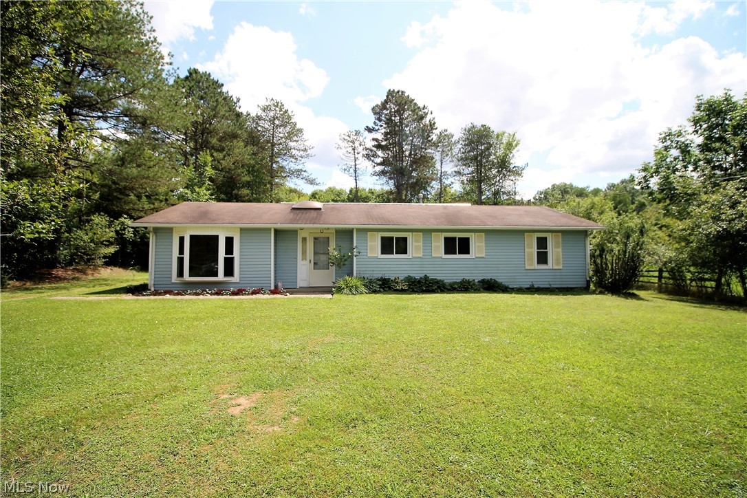 Welcome home to this three bedroom, one full bath ranch home. Everything on one level! Over an acre lot offering mature trees and landscaping, serene views. Come on into the family room, dining room and open eat in kitchen. The large family room is open to the kitchen which offers an abundant of cabinets and eat in area, sliding glass door to offer natural light to shine through and leads to the gorgeous backyard. There are three bedrooms and one full bathroom. There is a two car detached garage. The backyard goes another 250' into the woods. Just beautiful! Some updates include septic was serviced in (2019), painted (2017), garage roof (2018), garage was all tuck painted (2019). There are vinyl windows, gas furnace and A/C. Some many memories begin right here!