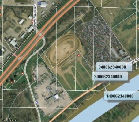 This Awesome property was the former location of successful Hilltop Auto Wrecking Company and the Legendary Hilltop Speedway. Currently, there is 17,384 sq/ft under roof with five structures. The sixth building needs to be raised and is of no value. A total of 31.651 Acres with Ohio River frontage, Blue Knob Road frontage, and Ohio Rt 7 Frontage with an exit/access Rd directly to the property. All utilities are available on site (Sewer on Septic) 400,000 Cubic Feet of Free gas Usage per year.
Total of twelve parcels : 34-62332, 34-62332.001, 34-62336, 34-62336.001, 34-62340, 34-62340.001, 34-62344, 34-62348, 34-62348.001, 34-62352, 34-63068, 34-63072