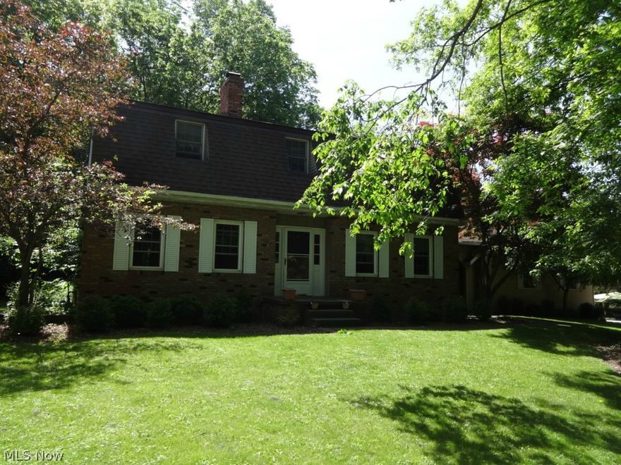 Dutch Colonial with four bedrooms, one on the main level, 3 full bathrooms, and 3 fireplaces situated on a private wooded half acre lot. Fireplaces grace the living room, family room, and master suite. Huge kitchen offers plenty of cabinet and counter space as well as nice sized eating area. The first floor offers a first floor bedroom/office with nearby full bathroom. The full basement is dry walled and awaits your finishing touches. The heated 2 car garage is accessed to the rear of the home. The wooded and private rear yard can be accessed from the family room as well as the dining room. The 2 tier deck can accommodate the largest of family gatherings. Updates: roof (2008), windows & sliding doors (2005-2006), HVAC, hot water heater, & basement sump pump (2003). Wonderful Hudson location close to Hudson's Historic District, shops, & restaurants.