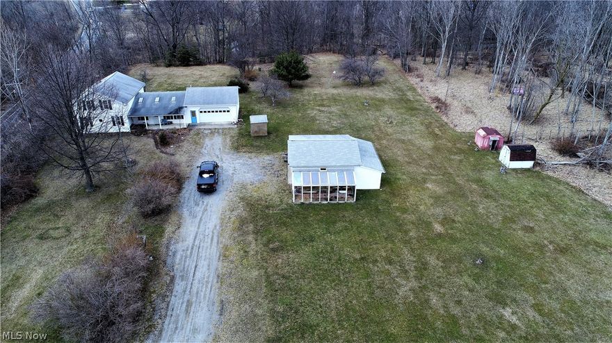 River front build-able 34.99 beautiful acres with a 4 bedroom 2 bath colonial home. On the main level of the home you will find the living room, spacious eat-in kitchen, master suite and 2 full baths. 80x44 pole barn. There's a 2 car attached garage. The land features apple trees and creek.  country living near the city this is a home you will want to see!