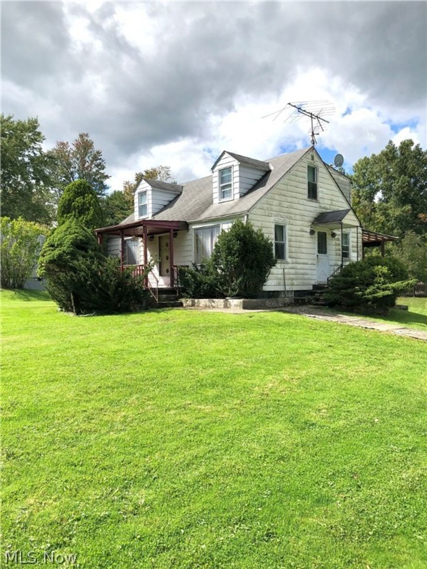 Cute Cape Cod with 1 1/2 Acre.  3 Bedrooms 1 on the first floor 2 on the second.  The main bath is on the first floor. There is a half bath for each bedroom.
There is another full bath in the lower walk out level.  The Kitchen is large and has many cabinets.  Most windows are replaced.  The property is gorgeous and the potential is there...Plaster walls, hardwood flooring under the carpet on the main floor.
