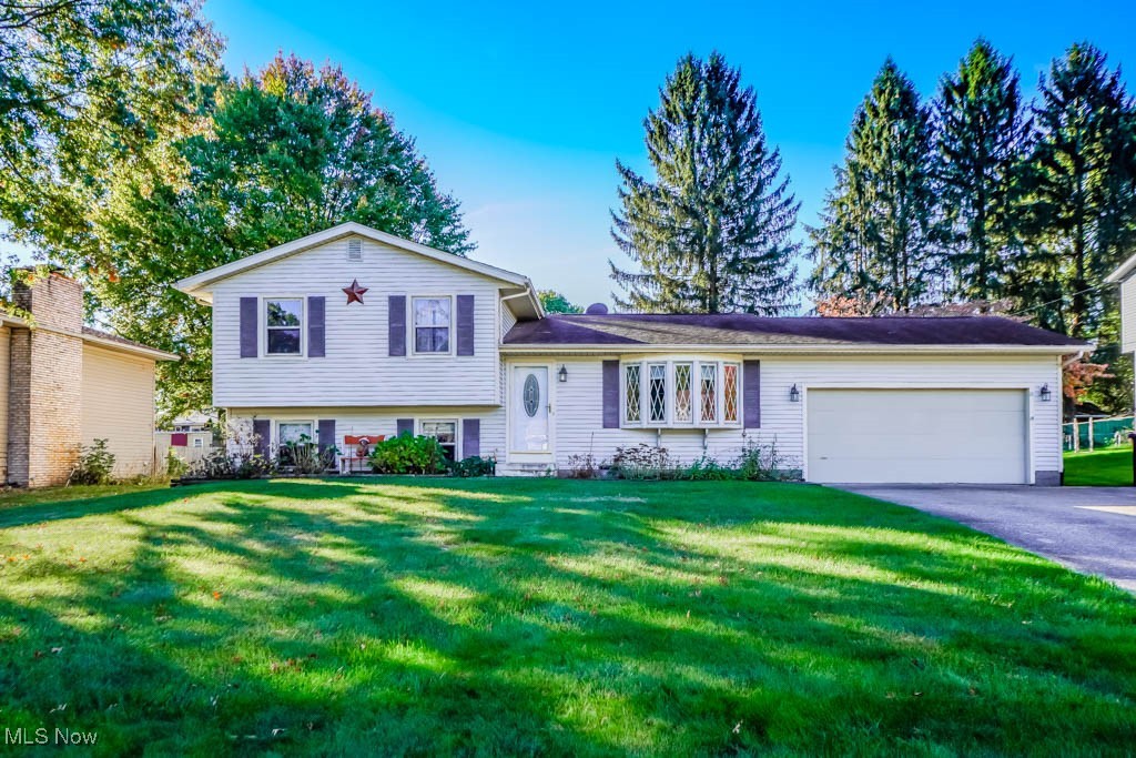 Discover this charming 4-bedroom, 1.5-bath, 4-level split located in Norton! The bright and inviting living room features a large window seat, accent wall, and plenty of natural light. The eat-in kitchen boasts granite countertops, ample cabinet space, and a sliding door leading to the covered 3-season room—perfect for relaxing or entertaining. Upstairs, you’ll find three comfortable bedrooms, each with ceiling fans, and a full bathroom. The lower level includes a cozy family room with built-in bookcases, a fourth bedroom, and a convenient half bath. Enjoy the outdoors with a patio, deck area, and storage shed—ideal for all your outdoor needs. This home offers both functionality and charm in a great location! Schedule your showing today!