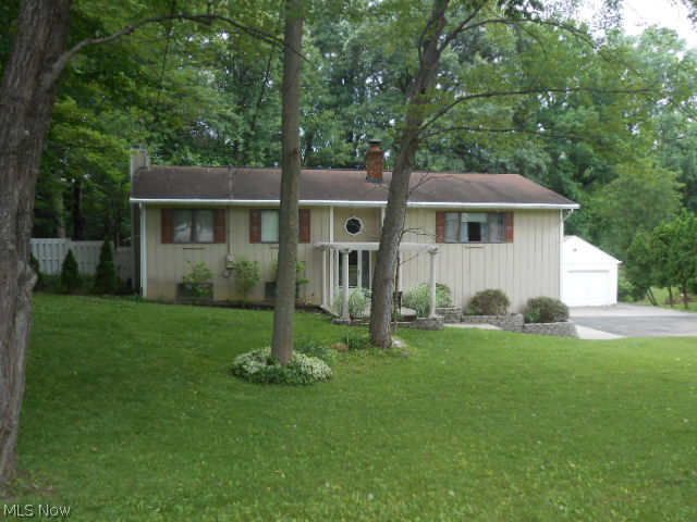 Cedar Sided home situated on a desirable Sackett Hills Dr. Must see! Tastefully updated kitchen and bathrooms plus spacious open floor plan with neutral decor throughout. Kitchen has Corian counters, wood cabinets and newer stainless appliances. Living room with fireplace plus a wood burner in family room. Customized closets with built in shelves and glass doors. Triple level deck overlooks big backyard. Two car attached garage plus detached garage/workshop. All appliances including washer & dryer. Home warranty too!