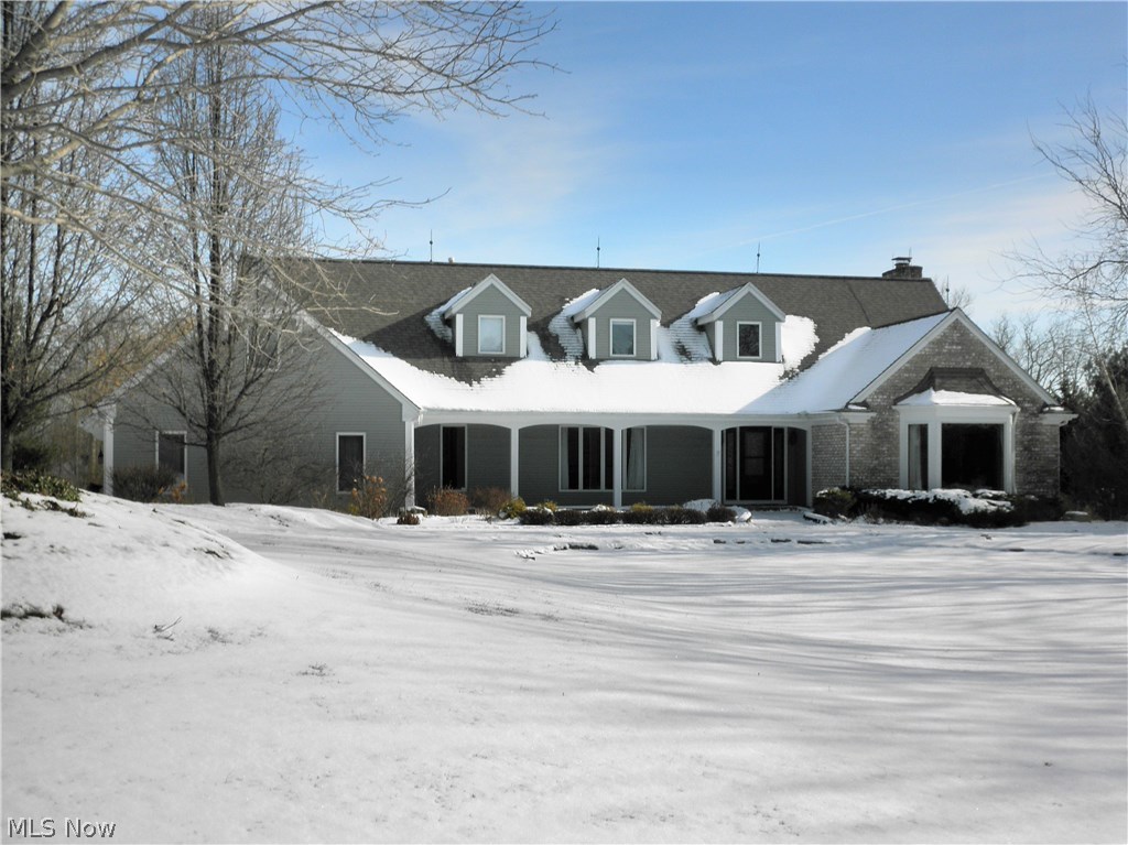 Charming 4 bedroom, 4 bath Brick/vinyl home in Bath Township. Spacious two-story foyer and front porch welcomes you! Beamed, vaulted living room with hardwood floors. Office off foyer features wall of built-in cabinetry. Family room over looks the 3 acre lot with Stone front wood burning fireplace. Updated kitchen and dinette include Cherry cabinetry, Corian countertops, center island with bar top and Birch flooring. Formal dining room with pocket door to kitchen. Master suite offers a gas fireplace, 2 closets, one walk-in and master bath with whirlpool roomy tub, stand up shower and ceramic finishes. Three additional bedrooms one of which could be a studio or theatre room and full bath with dual sinks and private shower room. Finished lower level and workshop. Beautiful property with rear patio and trails to enjoy. Anderson windows, dual furnace/AC's with zoned heating and central vacuum. Recent updates include Septic System (July 2017), Roof (2011), AC's (2013), well pressu