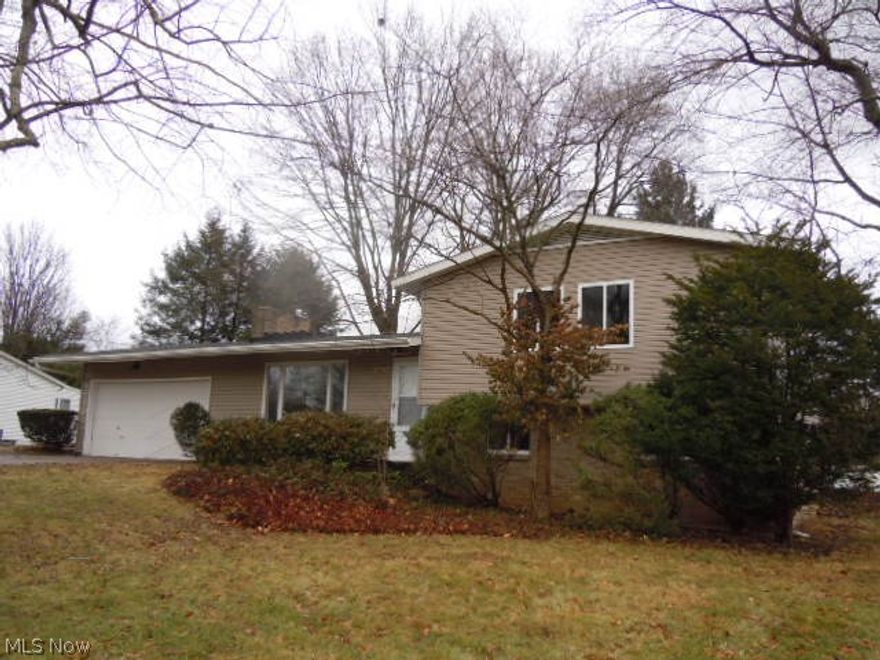 WOW FACTOR! Beautifully Remodeled Split Level. Brand New Vinyl Windows, Vinyl Siding and Gutters. The Huge Living Room Features Wood Burning Fireplace, Refinished Hardwood Floors, Beamed Cathedral Ceilings. The Kitchen Is Totally Remodeled With Soft Close Cabinets, Granite Counter Tops, Ceramic Floors and Backsplash! The Eating Area Opens Out To the Brand New Deck. Upstairs You Will Find 3 Spacious Bedrooms With Gorgeous Refinished Hardwood Floors. Main Bath Is Totally Remodeled With Huge Vanity, Sink and New Tub. New Ceramic Floors and All New Fixtures! The Lower Level Family Room Is Gorgeous Featuring New Can Lighting, Brand New Carpet and Its Own Full Bath. The Basement Has An Office Which Could Also Be A Bedroom. This Home Has It All! Make It Yours For the New Year!
