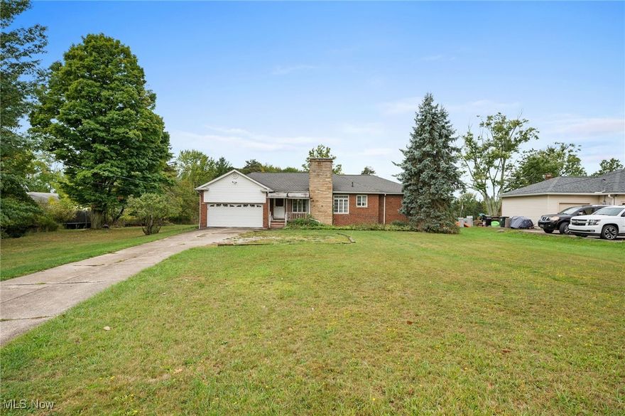 Attractive Brick and Stone Ranch .... Rare Find 3 Acre Setting .... Needs Some Updating and Improvements with Tremendous Upside Potential .... 2 Cozy Fireplaces .... 20' Inviting Living Room .... Family Room Had Functioned as a 1st floor Utility for Elderly Seller .... Three Bedrooms .... Full Basement ... Glass Block Windows .... Basement Appliances Also Remain .... Large 2 Car Attached Garage with Auto Opener  .... A Seldom Found Beautiful 3+ Acre Wooded Setting .... See MLS Attachments, Including Buyer Required Sewer Tap In Information