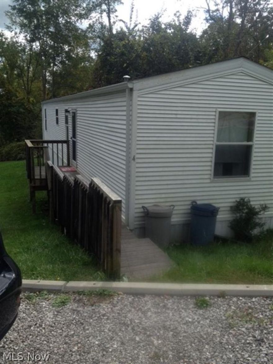 Rented lot #235. Includes water & sewer and owner must approve application. 3 bedrooms, 1 bath, handicap accessible with nice deck.