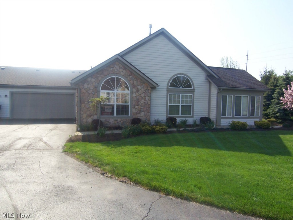 An exceptional Tallmadge condo with 2, possibly 3 bedrooms and 2 full baths. This 1700+ square foot unit also features a sitting room and office. The great room has a fireplace and opens to all rooms. The kitchen is open, with a formal dining area. The master suite is large with double sinks. The two car garage has water and is attached. There is a clubhouse with pool and rec area. This unit has been freshly painted, the carpet cleaned, and freshened up to be move in ready.