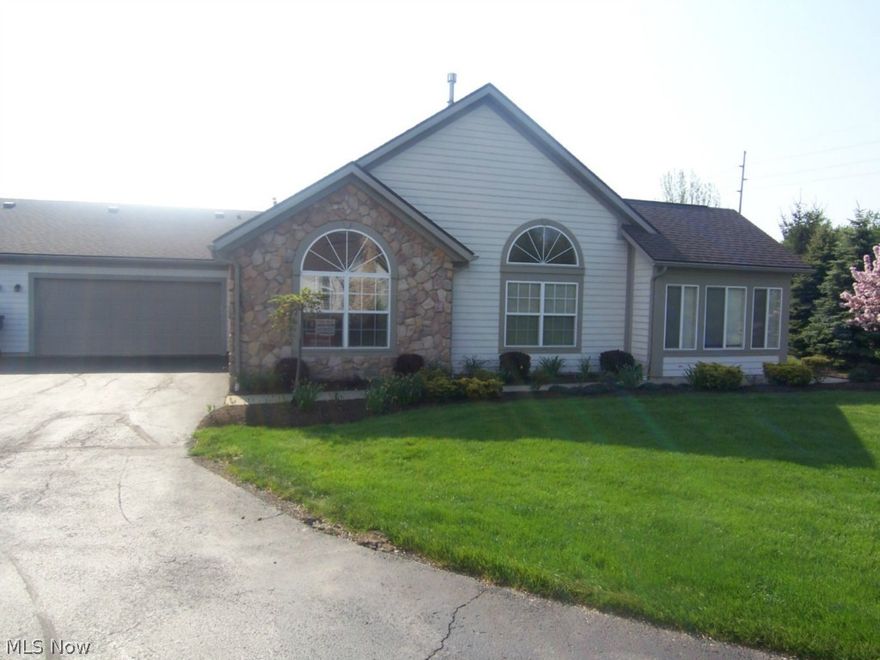An exceptional Tallmadge condo with 2, possibly 3 bedrooms and 2 full baths.  This 1700+ square foot unit also features a sitting room and office.  The great room has a fireplace and opens to all rooms.  The kitchen is open, with a formal dining area.  The master suite is large with double sinks.  The two car garage has water and is attached.  There is a clubhouse with pool and rec area.  This unit has been freshly painted, the carpet cleaned, and freshened up to be move in ready.