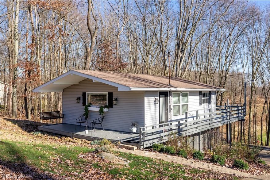 This adorable Lake Mohawk home would make a fantastic weekend retreat or year-round home. The house is surrounded by nature, & tucked away off of a quiet road. The wrap around deck is great for entertaining. This home has countless updates & features such as a fresh kitchen, sliding doors to the deck, a completely renovated lower level with second full bath, new light fixtures, basement waterproofing with lifetime warranty, new grinder pump, and a radon mitigation system. Great chance to get into the lake at a beautiful time of year! This home has great views of Beacon Lake, which is currently being turned into a nature preserve with a network of public walking trails & pavilion.