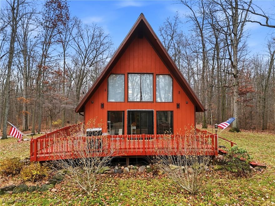 Discover your own private retreat! Nestled on just barely 12.86 peaceful, picturesque acres, complete with a stocked 1-acre lake, rolling wooded surroundings, and wildlife galore. This striking A-Frame home offers the perfect blend of tranquility and potential. The owner has already completed many upgrades including exterior paint, a newer metal roof, gutter guards, central A/C, newer appliances, and more… yet there’s still room for you to bring your vision and make it truly your own! Follow the winding driveway past the barn and fenced area to the inviting deck overlooking nature’s beauty. Inside, the main level features a bright kitchen, 2 bedrooms, a full bath, and a dramatic Great Room with a stunning wall of windows showcasing those gorgeous views! Upstairs, you’ll find a private bedroom and an additional full bath. The walkout lower level features a workshop area and access to the oversized ONE car garage. Enjoy free gas to the home! The barn opens up opportunities for livestock, storage, or your favorite hobby. Whether you're seeking peace, adventure, or a place to grow, this property delivers it all. Don’t miss the chance to make this extraordinary setting your own — schedule your private showing today!