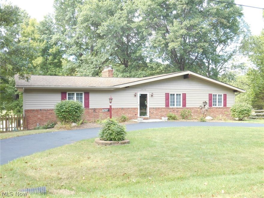 Welcome to this sprawling ranch located in desirable Suffield Township.  This amazing home has so much space and is situated on a large lot with waterfront views.  The oversized great room boasts vaulted ceilings & a 2 sided fireplace.  The master suite has a private bathroom and double closets.  There are two other nicely sized bedrooms and an updated bathroom.  The dining room opens to the fully applianced kitchen.  The fully finished walk out lower level has a family room with a fireplace and a separate office.  Enjoy fall evenings on your private deck overlooking the fabulous water view.  Don't forget the 2 car attached garage.  This welcoming abode offers wonderful space & privacy!  Home is move in ready and awaiting a new owner. Call to schedule a showing today!!