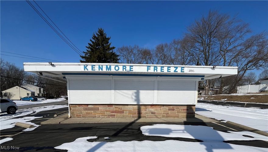 Prime commercial property located on a neighborhood corner of Akron.  Your future business is just an offer away.  This food stand that operated as an ice cream stand is new on the market just in time for you to be serving up cones to neighborhood children and families by this spring. Included with the sale is all the equipment that is needed to operate as a ice cream/food stand.  The building sits on nearing a half acre paved lot, giving you plenty of space to host the big crowds you can expect due to the school and baseball park located just across the street.  All appliances and equipment are included. Updates include: electric, stainless steel counter tops, windows with hurricane shutters, flooring, paint, security system and an advertising sign that has a customized imagery system. Don't miss out on this amazing opportunity to own this turn key operation that is sure to be money in the bank. Schedule a private tour today!