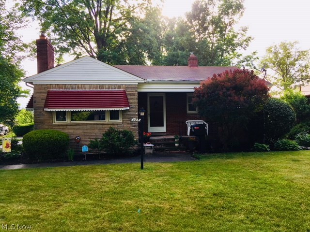 Looking for a home that is immaculate and move-in- condition? This might be it! Bonus - it's brick! Even the yard is beautifully landscaped, providing plenty of privacy. Not a typical property, a small portion of street, with dead end, runs between houses. Essentially, there is no one in back, or on one side. The quaint front porch is waiting for your swing. The vestibule entrance leads to the living room, hosting a fireplace with a 2-speed wood burning insert. Adjoining, is the dining room with built- in cabinets, and french doors leading to the 3 (or 4) season knotty pine room, custom blinds, leading to the 2-garage. Crown molding in the living and dining rooms, gives an elegant touch. The eat-in kitchen has newer cabinetry, counters, and faucet. All appliances stay, including washer and dryer. The entire first floor has hardwood under the carpet. The lower level has a full bath and a professionally finished recreation room, with a second fireplace. This room could easily